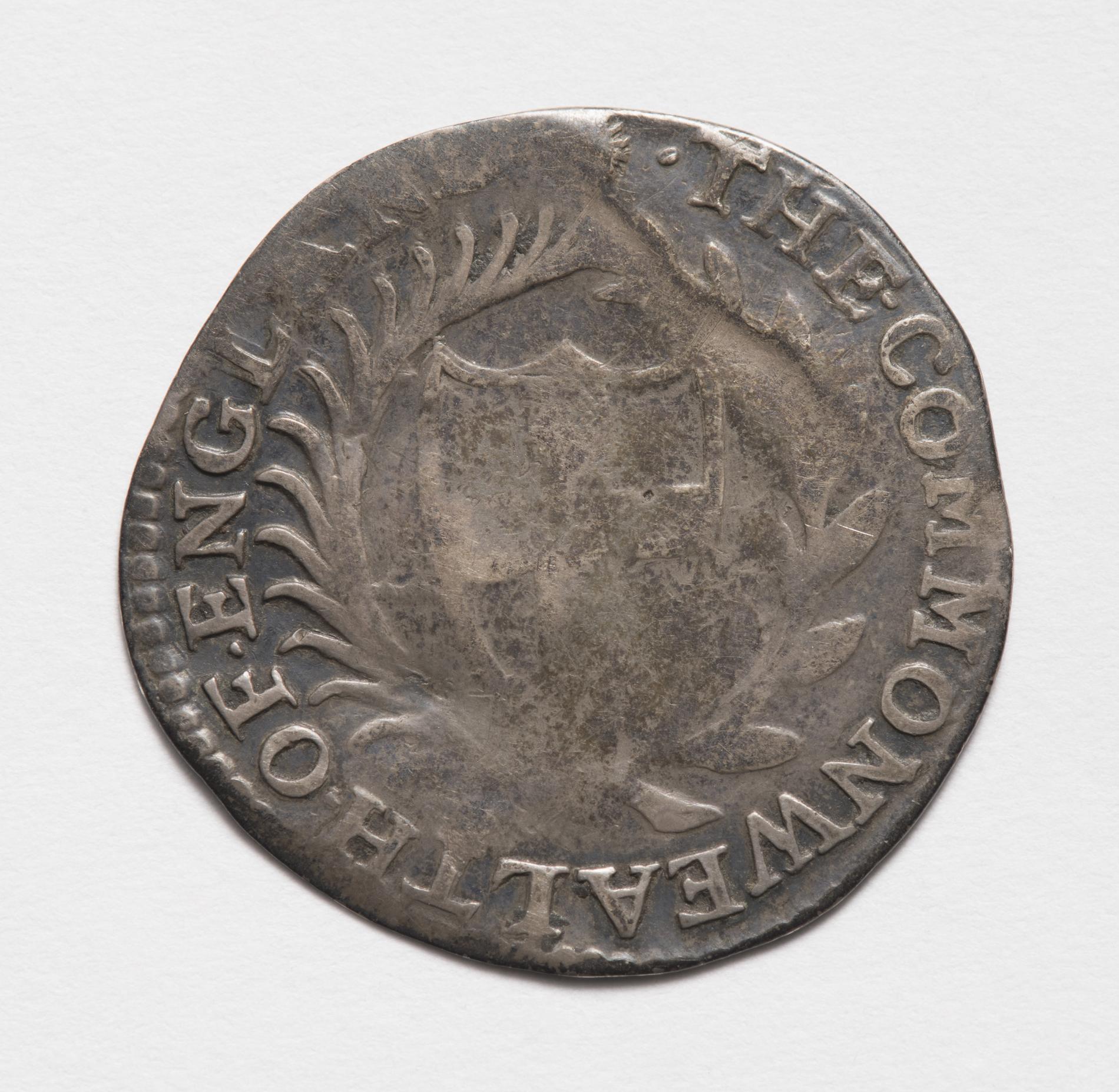 Photograph of a worn commonwealth sixpence Photograph of a worn commonwealth sixpence