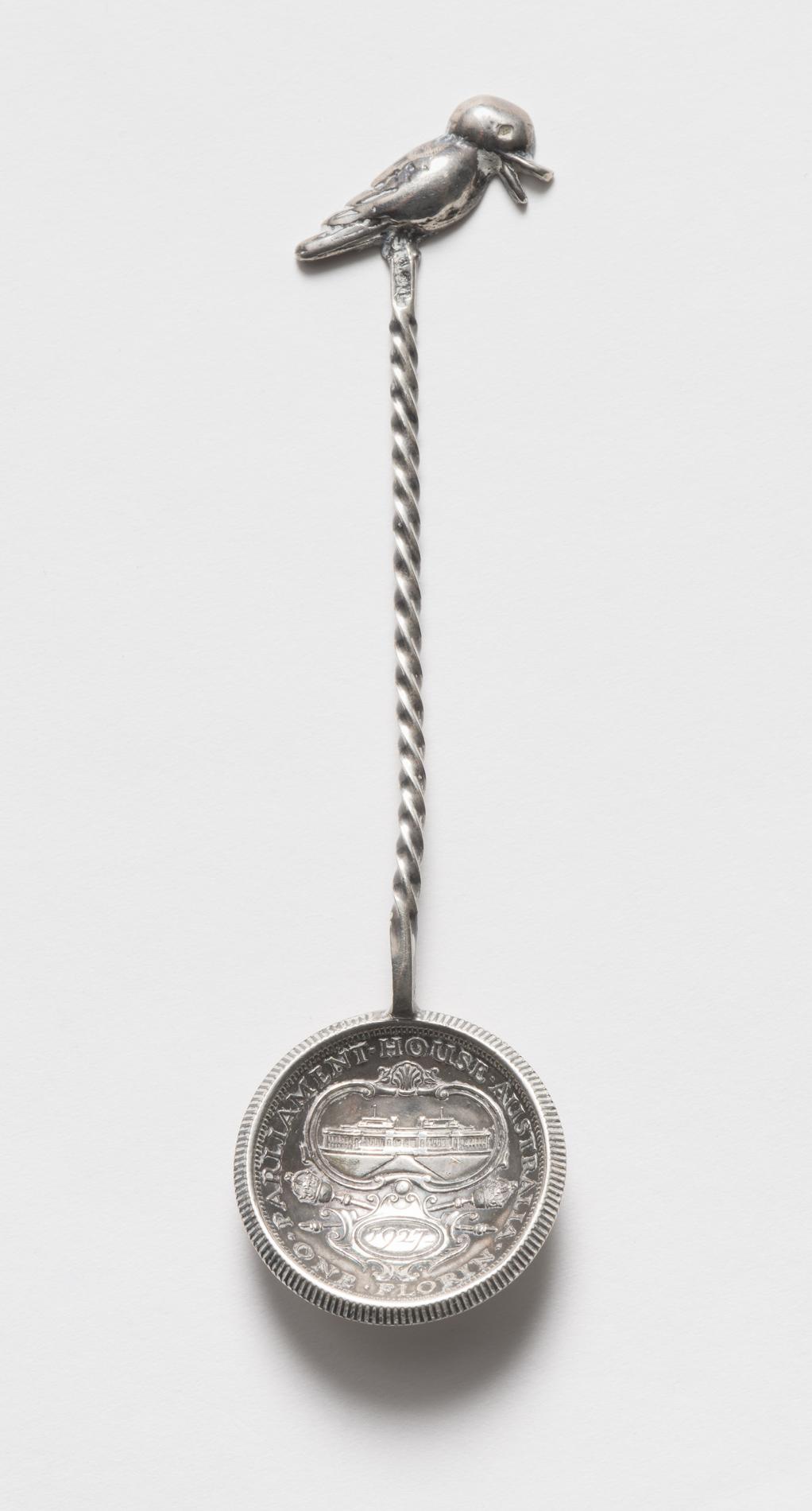 Photograph of an ornate souvenir spoon Photograph of an ornate souvenir spoon