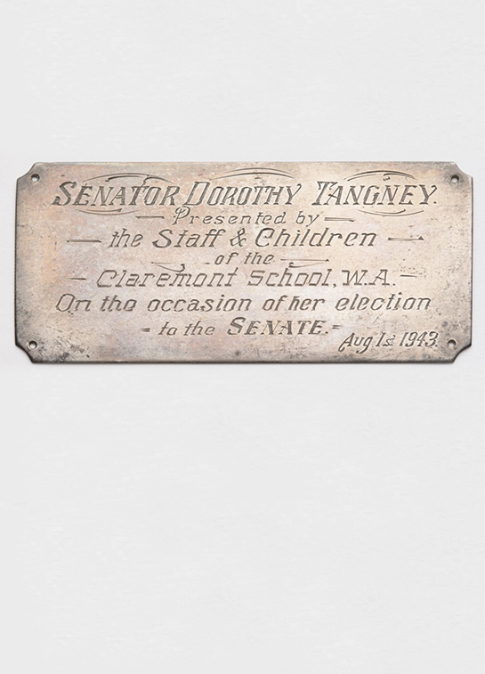 Photograph of a commemorative plaque siginifying Dorothy Tangney's election to the senate. Photograph of a commemorative plaque siginifying Dorothy Tangney's election to the senate.