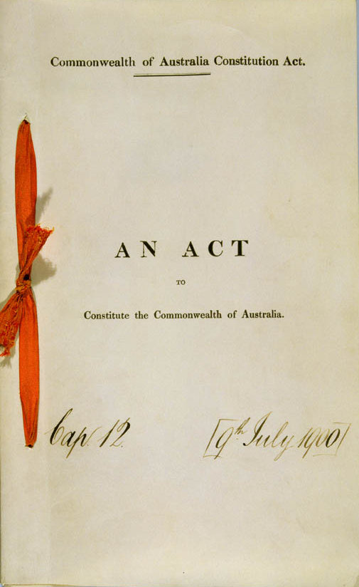 The front cover of the Australian Constitution dated 9th July 1900. A red ribbon on left side binds the papers together. The front cover of the Australian Constitution dated 9th July 1900. A red ribbon on left side binds the papers together.