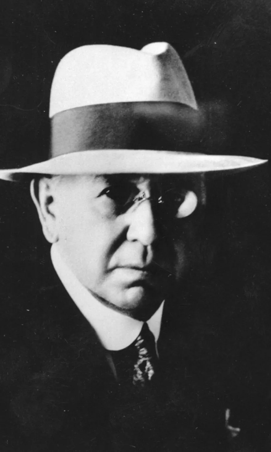 Portrait photograph of Frank Anstey, wearing a wide-brimmed hat with a thick dark band.. Portrait photograph of Frank Anstey, wearing a wide-brimmed hat with a thick dark band..